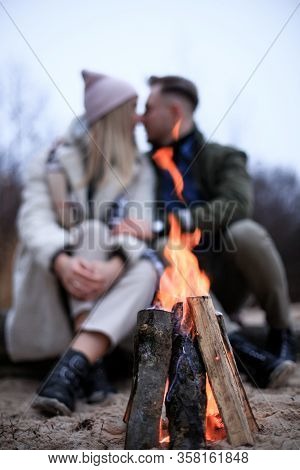 Winter Picnic On Baech With Bonfire. Love Story On Winter Foggy Sand Beach. Valentines Concept.