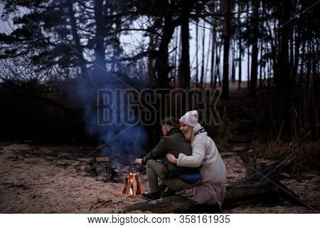 Winter Picnic On Baech With Bonfire. Love Story On Winter Foggy Sand Beach. Valentines Concept.