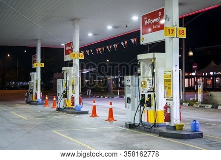 Petrol Pump Filling Nozzles At Shell Gas Station