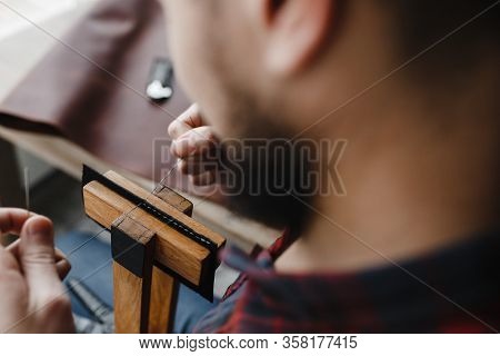 Man Hands Quilting The Leather With Filament On The Special Instrument
