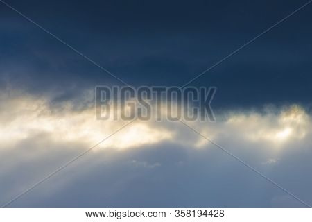 Rays Of Sunlight That Pass Through Gaps In The Clouds And Form Visible 