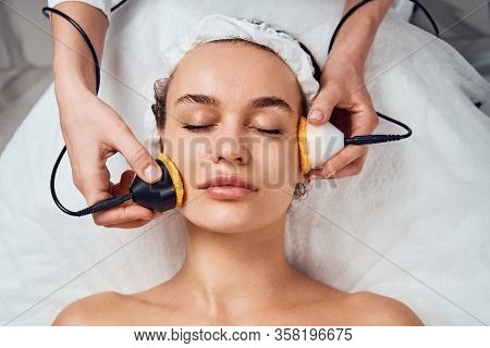 Face Skin Care. Close-up Of Woman Getting Facial Hydro Microdermabrasion Peeling Treatment At Cosmet