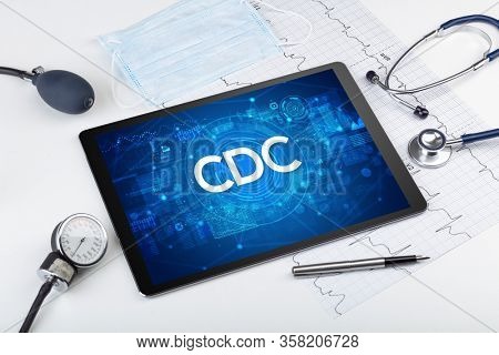 Close-up view of a tablet pc with CDC abbreviation, medical concept