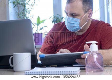 Quarantine Due Coronavirus Pandemic. Stay At Home. Business Man Working From Home, Wear A Protective