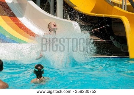 Turkler, Turkey - August 2, 2018: Water Park And Swimming Pool In Senza Hotel. Woman Going Down A Wa