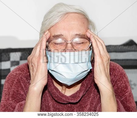 Elderly Woman In A Medical Mask