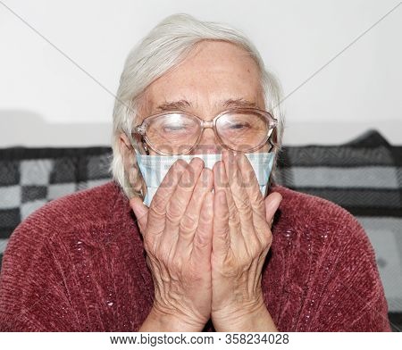 Elderly Woman In A Medical Mask