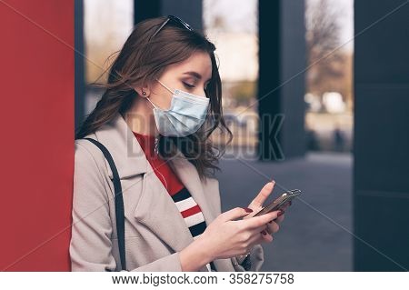 Young Woman Wearing Protection Face Mask Against Coronavirus Covid-19 Aka 2019-ncov Is Looking For I