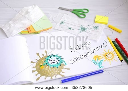 Children's Drawing Of A Coronavirus Molecule With Felt-tip Pens In An Album And On A Medical Mask. V