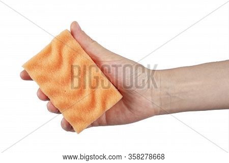 In Hand A Sponge For Cleaning On A White Background, Workhouse Concept. File Contains Clipping Path.