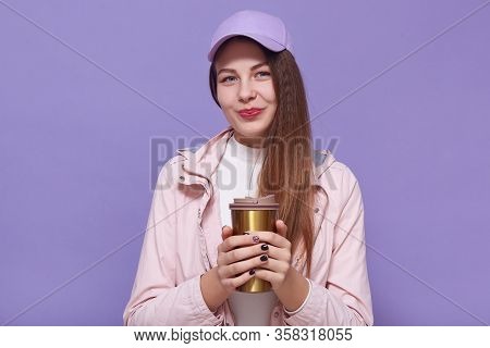Close Up Portrait Of Charismatic Charming Attractive Young Female Holding Themo Mug In Both Hands, D