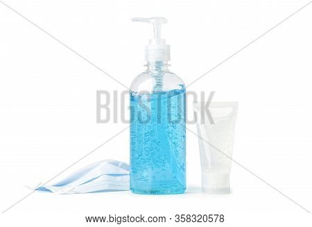 A Bottle Of Blue Alcohol Sanitizer Gel And Mask On White Background For Protect Safety Infection And