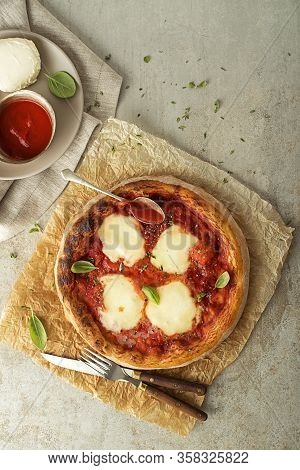 Pizza Margherita Served With Mozzarella Cheese, Tomato Sauce And Fresh Basil