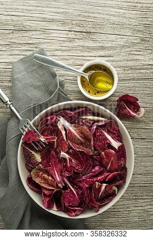 Healthy Red Lettuce Salad Meal On Wooden Table Background. Freshly Picked Radicchio