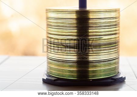 Lot Of Old Cds Stacked On The Windowsill
