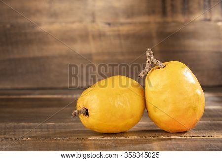 Spondias Purpurea - Delicious Tropical Fruit. Wood Background