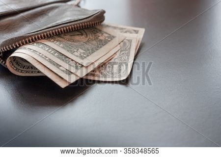 Dollar Cash In Leather Wallet On Black Background, Money Concept. One Dollar Banknotes. Place For Te