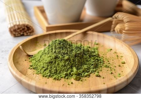 Matcha Green Powder And Tea On Gray Concrete Background