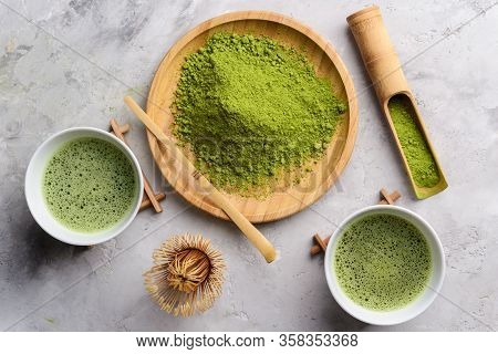 Matcha Green Powder And Tea On Gray Concrete Background