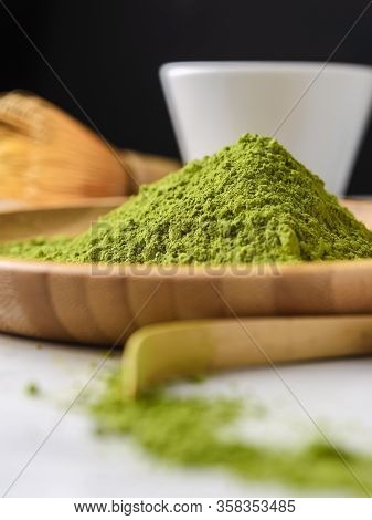 Matcha Green Powder And Tea On Gray Concrete Background