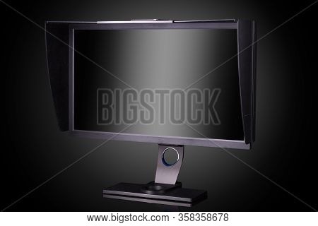 Professional Photographer Monitor With Shading Hood Isolated On Black