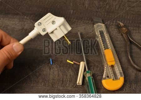 A Grounded Electrical Plug Is Installed On The Stranded Wire And Is Ready To Be Connected To The Net