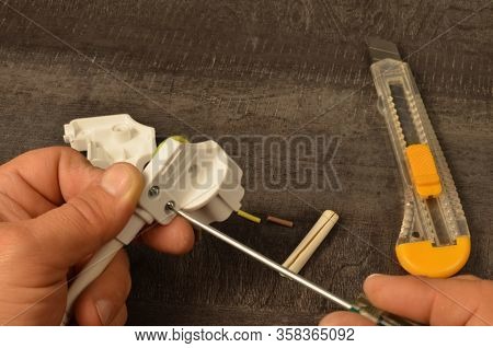 Detach The Bracket To Hold The Power Cord Inside The Power Plug