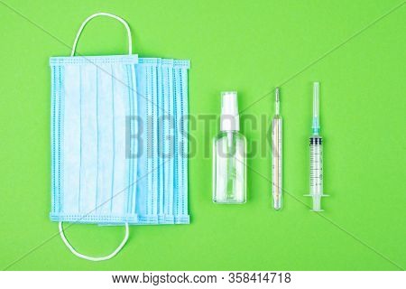 Top View Of Disposable Medical Protective Face Mask, Syringe And Mercury Thermometer, Antibacterial 