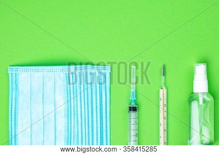 Top View Of Disposable Medical Protective Face Mask, Syringe And Mercury Thermometer, Antibacterial 