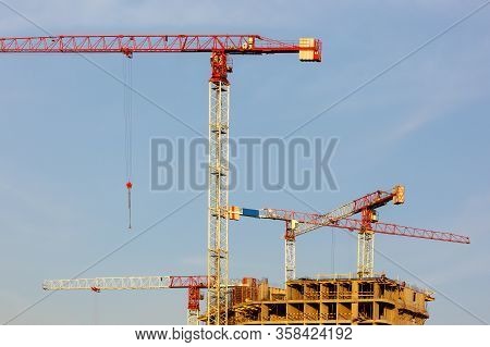 Tower Cranes Working On The Construction Of The Building
