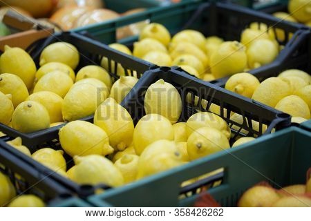 Lemons In Crates On Supermarket. Healthy Food. Vitamins.