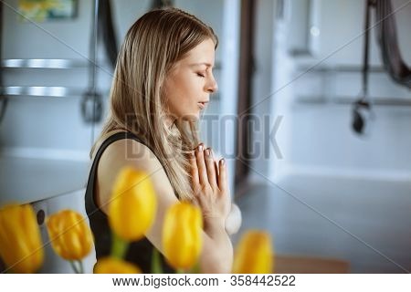 A Beautiful Young Girl Meditates After A Yoga Class. Rest, Relaxation, Healthy Lifestyle