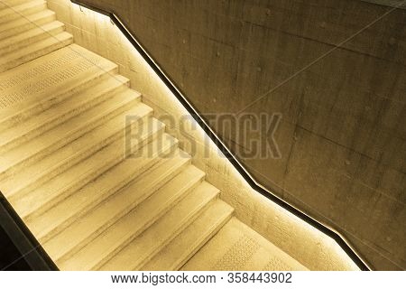 Empty Stairway With Illuminated Bannister In Modern Architecture