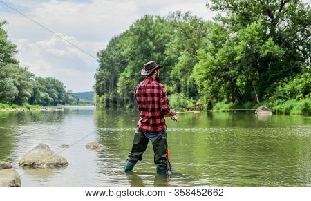 Hobby And Sport Activity. Pothunter. Bearded Fisher In Water. Fisherman With Fishing Rod. Mature Man