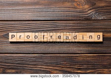 Proofreading Word Written On Wood Block. Proofreading Text On Table, Concept