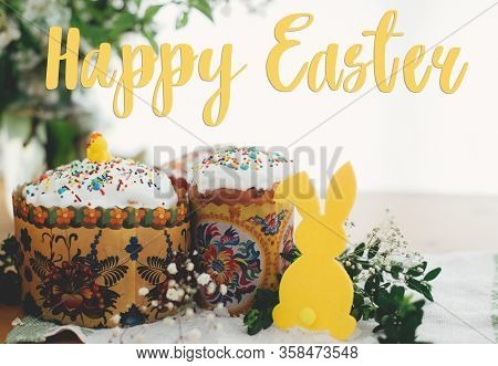 Happy Easter Text. Easter Greetings Lettering. Homemade Easter Cake, Bunny Decor, Green Branches And