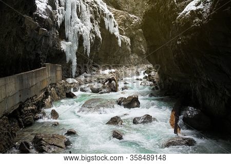 Snow-covered Icicles At Partnachklamm, Famous Tourist Destination. Partnachklamm In Garmisch-partenk