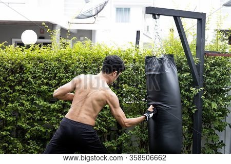 The Man Hit To Bag On Boxing Training, He Has Target For Fighting.