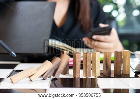 Growing Business Concept. Business Woman Picking Domino Blocks For Filling The Missing Dominus And P