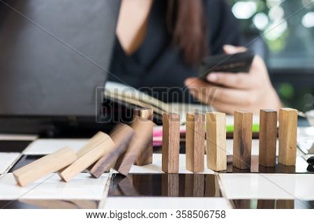 Growing Business Concept. Business Woman Picking Domino Blocks For Filling The Missing Dominus And P
