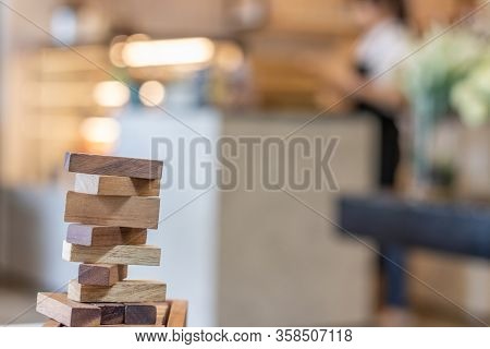 Growing Business Concept. Business Woman Picking Domino Blocks For Filling Th