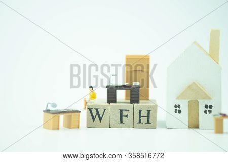 Concept Of Wfh - Work From Home Acronym.
People Work At Home To Prevent Virus Infection.