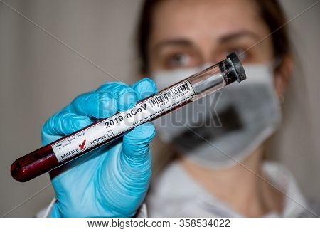 A Female Doctor Holding Covid-19 Blood Sample Hispeed Test Tube