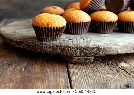 Muffins - Delicious Pastries. Delicious Dessert On The Table - Homemade Muffins. Portioned Cupcakes.