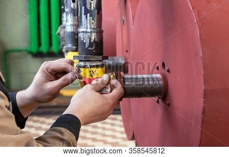 Fitter To Reel Up The Seam Fum Tape On The Connection In The Gas Pipeline.