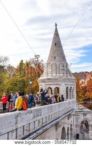 Budapest, Hungary - Nov 6, 2019: Tourists Sightseeing And Taking Photos Of Fishermans Bastion In The