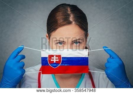 Coronavirus In Slovakia Female Doctor Portrait Hold Protect Face Surgical Medical Mask With Slovakia