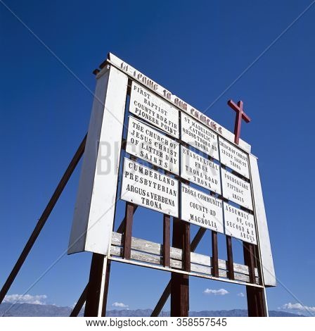 Sign At Trona, Usa, With Text That Welcomes You To Our Churches