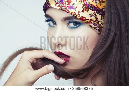 Young Pretty Modern Girl With Bright Shawl On Head Emotional Posing Isolated On White Background, As