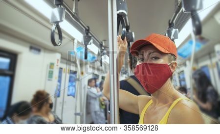 Woman Travel Caucasian Ride At Overground Train Airtrain With Wearing Protective Medical Mask. Girl 